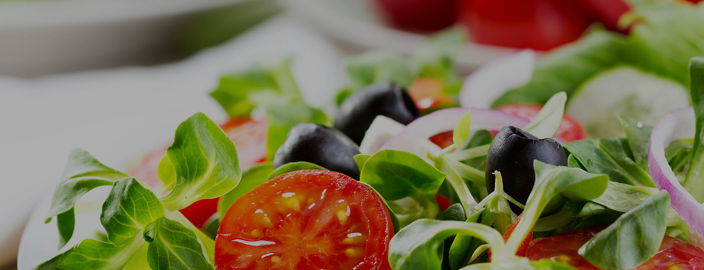 A close up of tomatoes and other vegetables